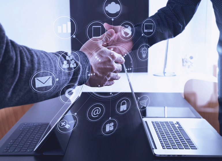 Close up of a business owner shaking hands with a VCIO from Digital Sky Solutions agreeing to get IT strategy and planning support for their small business.