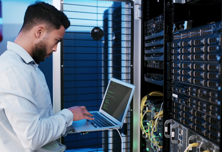 Managed IT support technician checking the servers for a Victoria business
